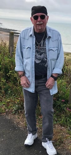 Reviewer standing outdoors wearing a casual outfit while using XARA SHILAJIT Pure Shilajit Gummies.